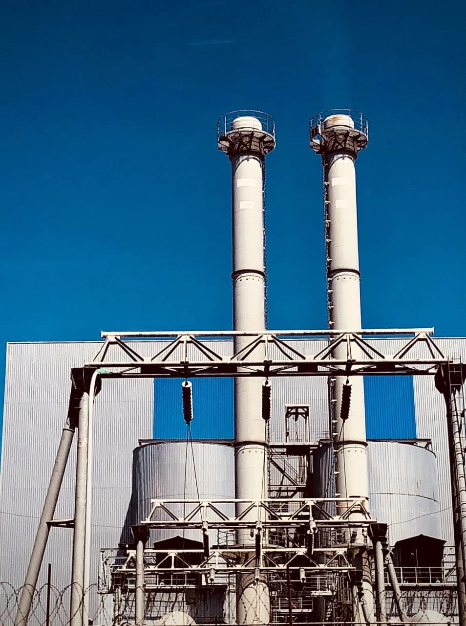 Industrial power infrastructure with two tall exhaust stacks